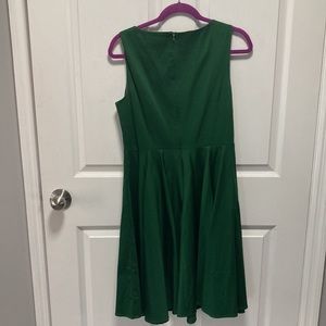 green sleeveless dress.